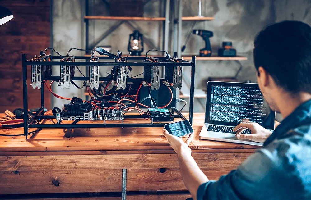 A photo of a programmer preparing mining rig with GPU